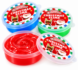 Four round plastic tubs of Christmas-themed slime on a white background, showing red, blue, green, and clear-lidded containers with colorful labels reading 'Merry Christmas Christmas Slime' and Santa illustrations.