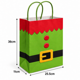 A green and red elf-themed paper gift bag with a black belt and yellow buckle detail, shown with dimension lines indicating 36cm height, 25.5cm width, 11cm depth, and green handles on a white background.