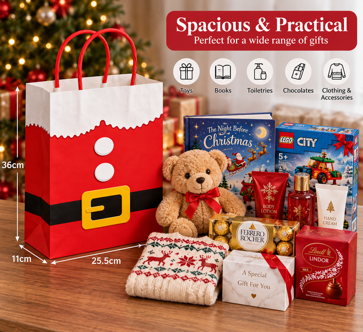 A Christmas-themed gift set arranged on a wooden table in front of a blurred Christmas tree. The set includes a large red and white Santa gift bag with black trim, a brown teddy bear, LEGO toy boxes, Ferrero Rocher chocolate, Lindt chocolate, a knitted sweater, and gift cards, with a red text banner at the top showing product features and dimensions.