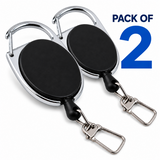 Two retractable badge reel keychains with black oval faces and shiny silver metal clips, shown on a white background with blue text reading 'PACK OF 2'.