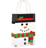 Gift bag designed like a snowman with a black top, red band, green scarf, and carrot nose on a white background.