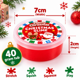 A round tub of red Christmas-themed slime with a festive Santa label, shown on a white background with dimension arrows indicating 7cm width and 2cm height, plus a green ornament badge reading 40 gram tub and usage text for stretch, squish, squeeze, and play.