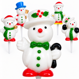 A set of Christmas snowman cake toppers on white picks, featuring a large central snowman with a green bow tie, red nose, and red boots, surrounded by smaller snowmen in festive hats and scarves.