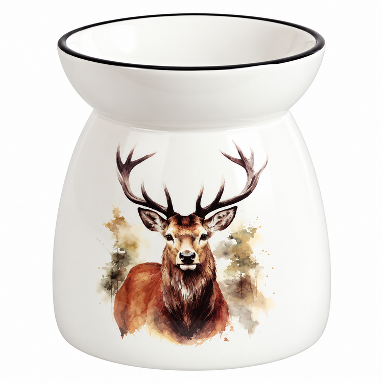 A white ceramic oil burner or scented candle holder with a black rim, featuring a painted brown deer head with antlers on the front, set against a plain white background.