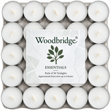 A pack of 50 Woodbridge Essentials tea lights in a clear plastic tray, with a central white label showing the brand name and leaf logo.
