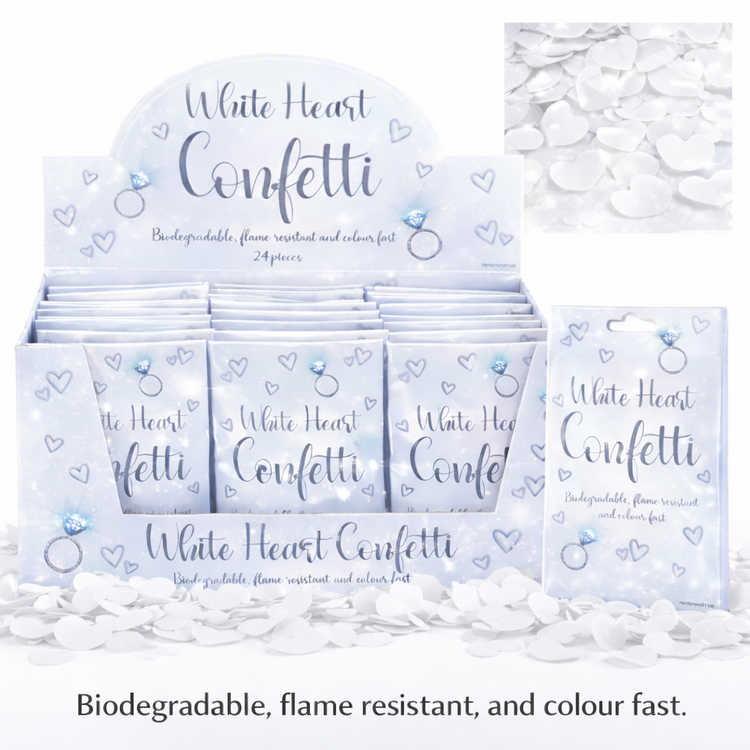 Display of white heart confetti packets with packaging and scattered confetti on a white background.