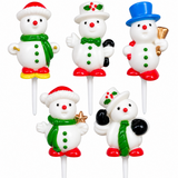 Five Christmas snowman-shaped cake toppers on white plastic sticks, each with a different festive outfit including red hats and boots, green scarves and bow ties, and black gloves, shown on a plain white background.