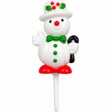 A white snowman-shaped stick decoration with a white hat decorated with green holly leaves and red berries, a green bow tie, green buttons, red shoes, and a black cane, shown on a plain white background.