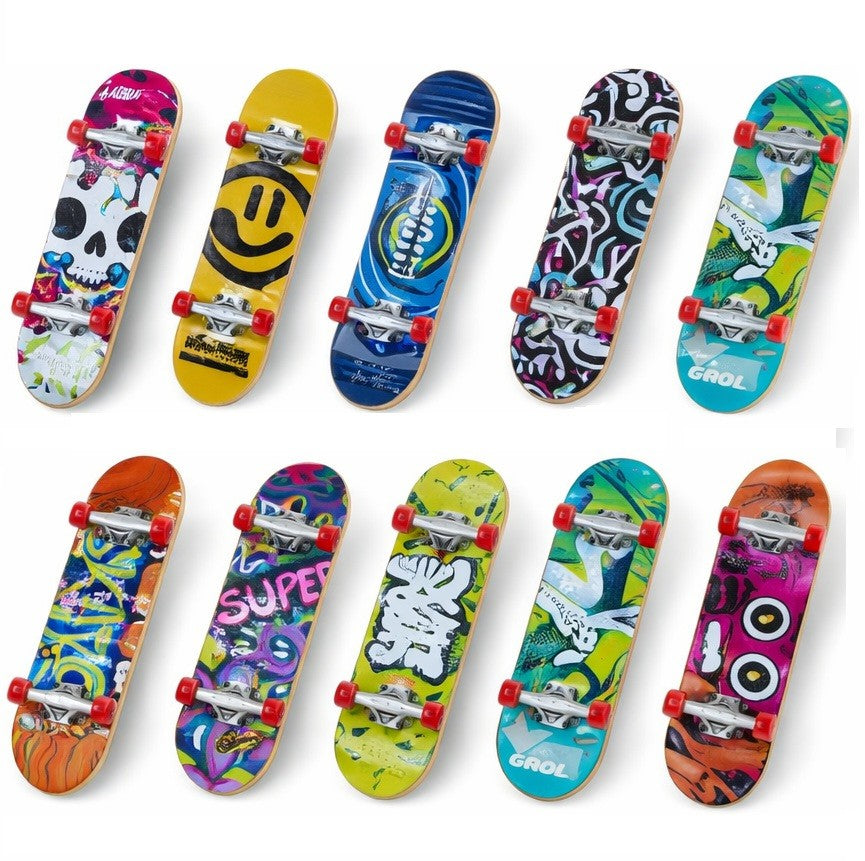Collection of colorful mini skateboards with various designs on a white background
