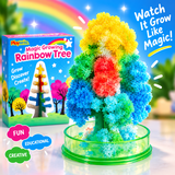 A colorful 'Magic Growing Rainbow Tree' toy set shown with its retail box. The product consists of a green plastic base filled with sparkling, flower-like beads arranged in a rainbow pattern of yellow, white, red, orange, green, and blue.