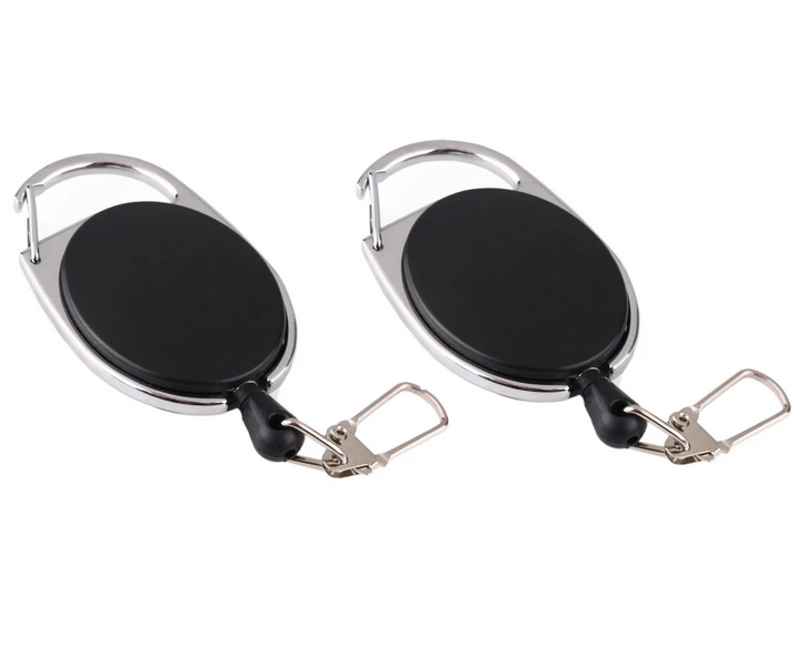 Two black retractable keychains with metal clips on a white background