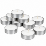 A set of nine silver metal tea light candles with white wax and wooden wicks, arranged in a pile on a clean white background.