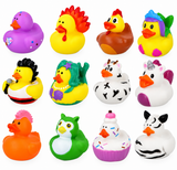 Twelve colorful rubber duck toys arranged in a 3-by-4 grid on a plain white background. The ducks feature various novelty designs including a purple duck with a flower, a yellow rooster, a brown duck in a shell, a duck with a rainbow hat, a yellow duck with black hair, a green-and-yellow duck with a pearl necklace, a black-and-white duck with hearts, a white duck with a unicorn horn, an orange duck with a pink mohawk, a green owl, a cupcake duck, and a zebra duck.