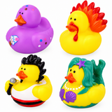 Four novelty rubber duck toys arranged in a 2x2 grid on a white background: a purple duck with colorful dots, a yellow duck with a red-orange flame crest, a yellow duck dressed as Elvis Presley, and a yellow duck dressed as a mermaid with green hair and a purple star.