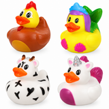 Four colorful rubber duck toys arranged in a 2x2 grid on a white background: a yellow rooster duck with a brown body and red comb, a yellow duck with a blue and purple hat, pink shells, and green wings, a white cow duck with black spots, and a white unicorn duck with a silver horn and pink mane.