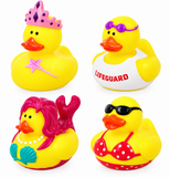 Four yellow rubber duck toys arranged in a 2x2 grid on a white background, each styled with a different costume: a pink tiara and wand, a white lifeguard vest, a mermaid outfit with pink hair, and a red polka-dot bikini with black sunglasses.