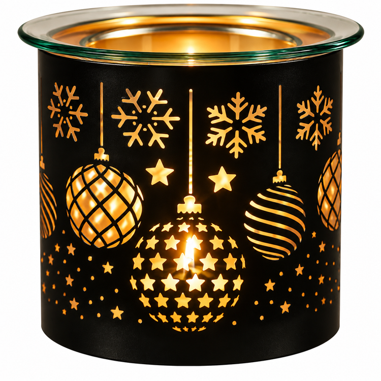 A black cylindrical candle warmer with a clear glass top, decorated with gold laser-cut snowflakes, stars, and hanging ornaments, glowing warmly from within.