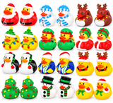 A 4x6 grid of 24 colorful Christmas-themed rubber duck toys on a plain white background. The set includes Santa Claus, snowman, reindeer, penguin, Christmas tree, and snowman designs in red, white, blue, green, yellow, and brown.