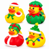 Four Christmas-themed rubber duck toys arranged in a 2x2 grid on a white background. The top-left duck wears a Santa hat and bow; the top-right wears an elf hat and collar; the bottom-left is wrapped in a red gift with a green bow; the bottom-right has a Christmas tree hat and colorful holiday lights.