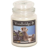 Woodbridge candle jar with a teddy bear and towel design on the label