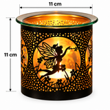 A black metal candle holder with a glowing warm light inside, featuring a cutout fairy and floral design. The image includes dimension lines showing 11 cm width and 11 cm height on a white background.