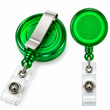 Two green retractable badge reel clips shown on a white background, one with the clip extended and one folded, both featuring a clear plastic clip attachment and a metal ball bearing.