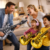 Family playing with inflatable guitars in a living room