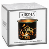 A boxed wax melt product from Aroma Accessories. The white and gray retail box shows a printed image of the black cylindrical wax melt container with gold lettering that reads 'Home Sweet Home' and a gold wax pool at the top.