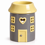 A ceramic house-shaped candle holder or pot with a gray body, yellow roof, yellow windows, and a yellow door on a white background.