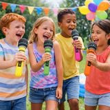 Four children holding microphones outdoors with colorful balloons and flags in the background