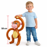 Child standing next to a toy monkey with dimensions indicated