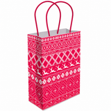 A red and white patterned gift bag with red paper handles, featuring a festive holiday design with snowflakes, stars, and reindeer silhouettes, shown on a plain white background.