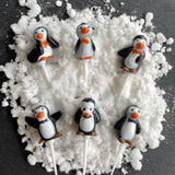 pack of 6 christmas penguin cake toppers on snow