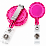 Two retractable badge reel clips shown on a white background, one from the front and one from the side. The reels are translucent hot pink, with a silver metal clip and a clear plastic badge holder.
