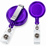 Two views of a purple and silver retractable badge reel with a clear plastic clip on a white background.