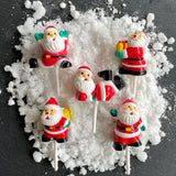 pack of 5 christmas santa cake toppers on snow
