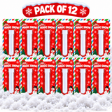 Twelve packaged 'Magic Snow' novelty items arranged in two rows on a white snowy surface, with a red 'PACK OF 12' banner above. Each package is red with snowflake patterns, candy cane stripes, and snowman illustrations.