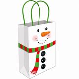 A white paper gift bag with a snowman face and a red and green striped scarf, featuring green paper handles, shown on a plain white background.
