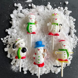 pack of 5 christmas snowman cake toppers on snow