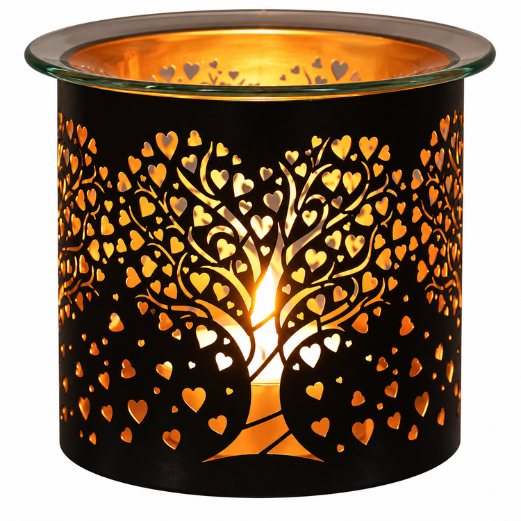 A black metal candle holder with a laser-cut tree of hearts design, illuminated from within to cast a warm golden glow, shown on a plain white background.