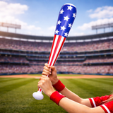 Person holding a baseball bat with American flag design on a sports field
