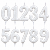 Ten sparkly silver number candle toppers from 0 to 9, arranged in two rows on a plain white background.