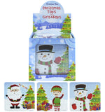 Display of Christmas-themed children's toys including puzzles with Santa, elf, and snowman designs.