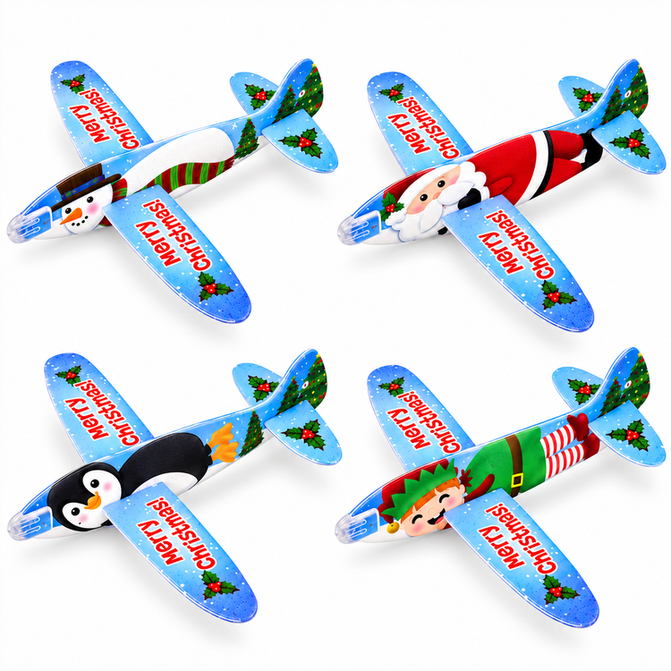 Four Christmas-themed inflatable or plush toy airplanes arranged in a 2x2 grid on a white background. The airplanes feature different holiday characters: a snowman, Santa Claus, a penguin, and an elf.