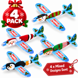 Four Christmas-themed airplane ornaments shown on a white background, each with a different holiday character design including Santa Claus, an elf, a snowman, and a penguin. The planes are light blue with red 'Merry Christmas' text, green holly accents, and festive patterns.