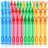 A set of 24 plastic bubble wand tips arranged in rows by color, featuring Christmas tree, snowflake, and reindeer antler designs in blue, red, green, yellow, and orange.