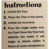 Instructions for setting up a decorative tree with text on a cardboard background