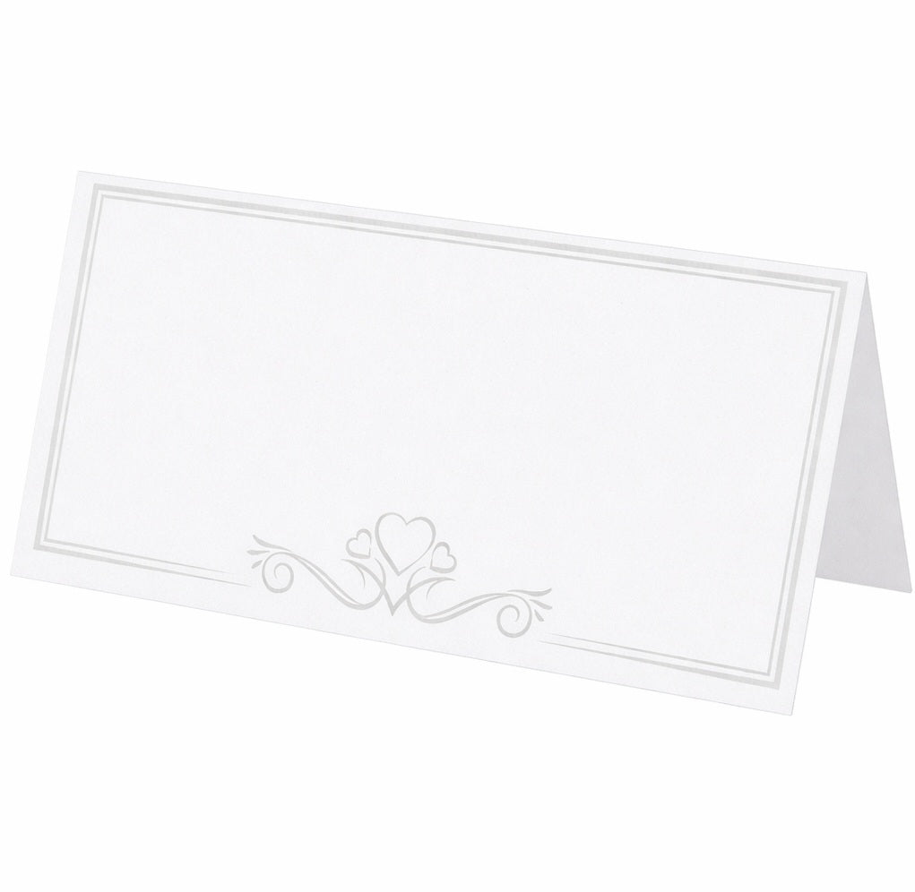 White place card with decorative heart and swirl design on a white background