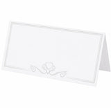 White place card with decorative heart and swirl design on a white background
