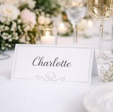 Place card on a table setting with flowers and candles